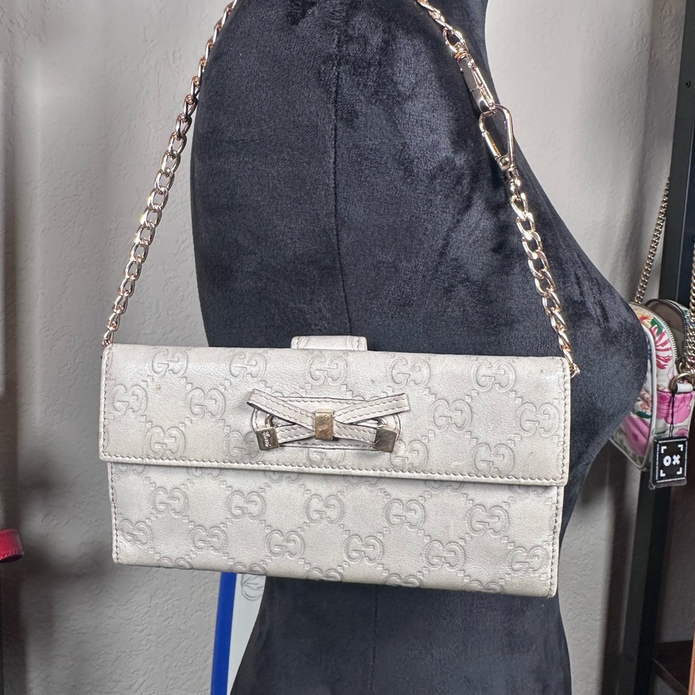 Authentic Gucci Light Gray Embossed Clutch Wallet with Bow Accent